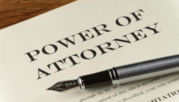 Picture of Power of Attorney document with pen