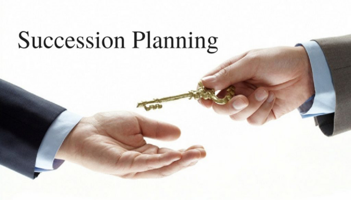 Succession-Planning image - man passing key to a man